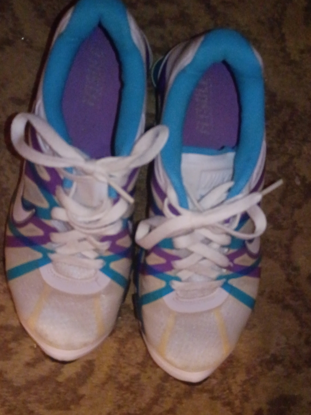 Nike Women's White Athletic Sneakers with Purple & Teal Accents